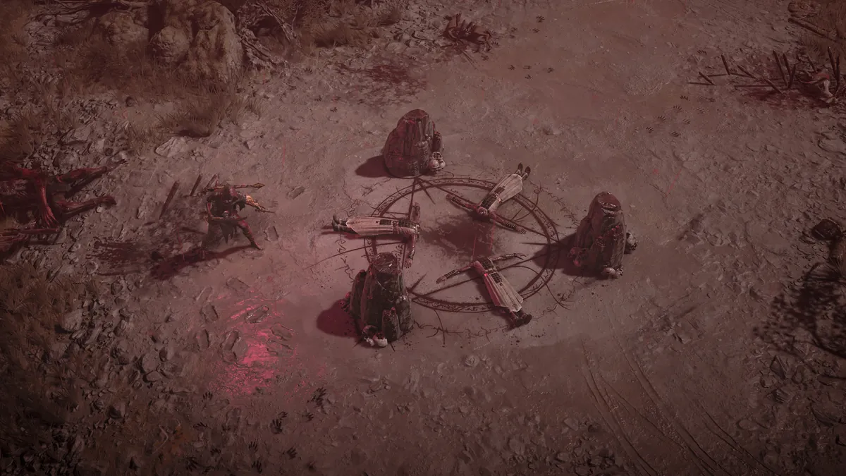 An Accursed Ritual site in a Diablo 4 Helltide: a dark ritual circle with stone altars around it on dusty red ground