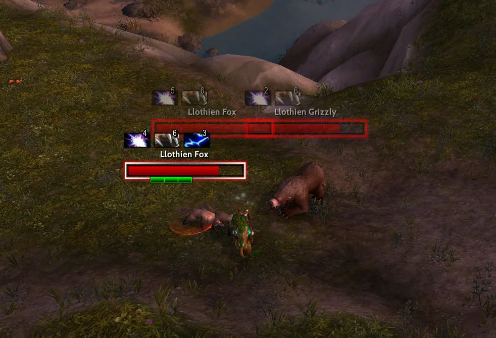 Two red health bar nameplates with debuff icons above them on a Llothien Fox and a Llothien Grizzly in a grassy field, the targeted one with a white frame and a green threat bar.